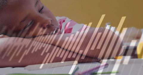 Child sleeping at desk with abstract data visualization
