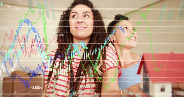 Happy Businesswomen Analyzing Financial Data Graphs - Download Free Stock Images Pikwizard.com