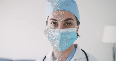 Female clinician wearing surgical mask and cap, fractured digital mesh overlay concept