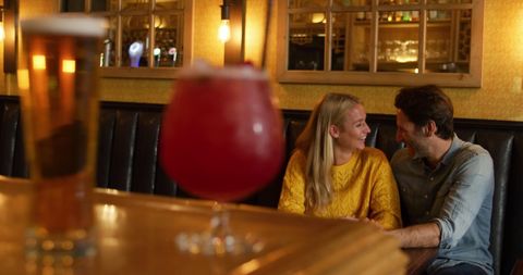Couple Enjoying Romantic Evening Date at Cozy Hotel Bar