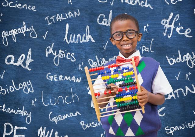 Young African American boy holding an abacus in front of a chalkboard filled with various school subjects. Ideal for educational materials, school promotions, learning resources, and advertisements focused on children's education and academic success.