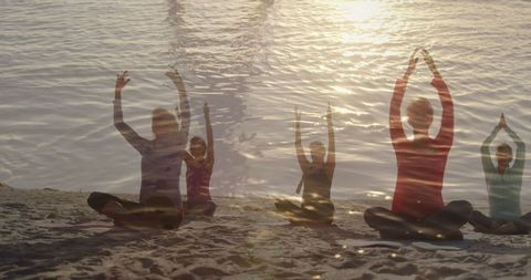 Seaside Yoga Amidst Sunset for Relaxation and Wellness