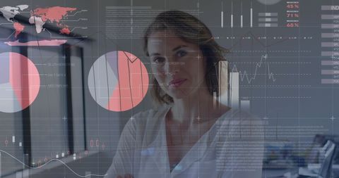 Businesswoman Analyzing Financial Data Interfaces in Modern Office - Download Free Stock Images Pikwizard.com