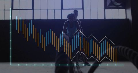 Intense battle ropes workout in industrial gym setting