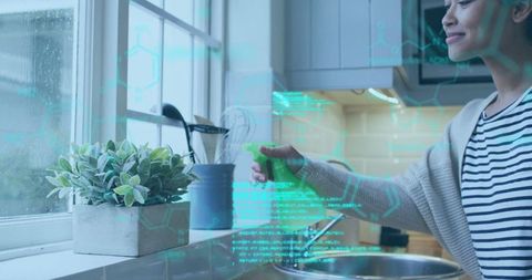 Woman Nourishing Kitchen Plant, Promoting Home Greenery and Well-Being