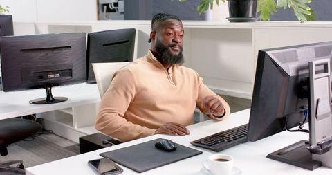 Business Professional Discussing Strategy in Modern Office Setting