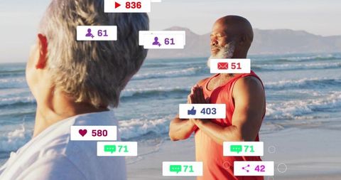 Two men practicing mindfulness on beach with floating social media notification icons