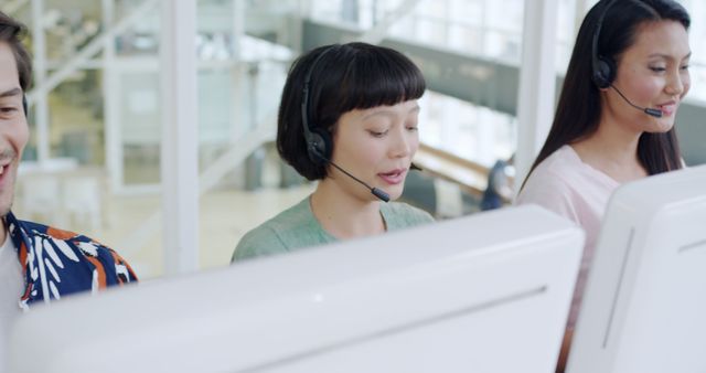 Customer Service Team Working with Headsets in Modern Office - Download Free Stock Photos Pikwizard.com