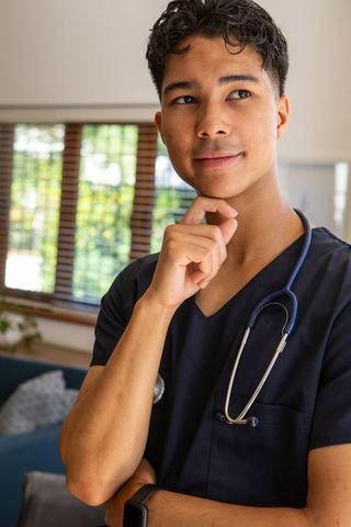 Young Medical Professional Wearing Navy Scrubs and Stethoscope