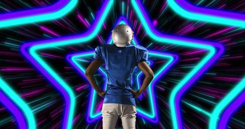 Football Player Standing Confidently Before Neon Star Tunnel
