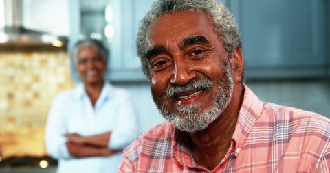 Happy Senior Couple Enjoying Time Together in Modern Kitchen