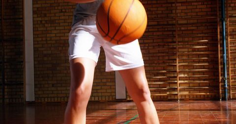 Young Athlete Dribbling Basketball in a Gymnasium Setting - Download Free Stock Images Pikwizard.com