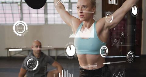 Female athlete lifting barbell overhead in industrial gym with hud fitness analytics