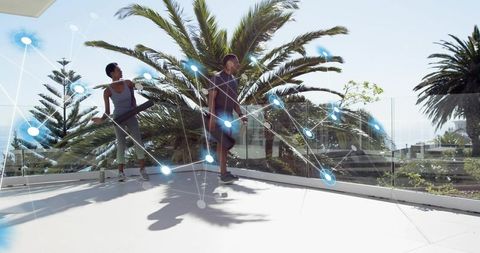 Friends exercising on rooftop holding resistance bars with fitness network overlay