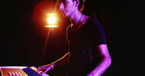 Young Musician Performing with Keyboard on Stage - Download Free Stock Images Pikwizard.com