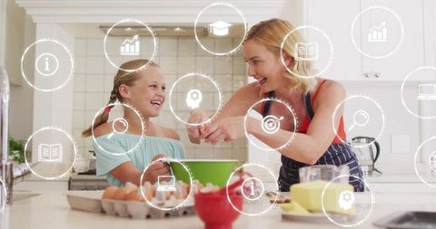 Mother and daughter baking together in bright kitchen with digital learning icons