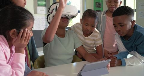 Multiracial Kids Exploring Virtual Reality Together During Classroom Technology Lesson