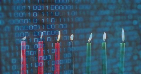 Kwanzaa Kinara Candles Flickering with Binary Code Overlay for Modern Tech Celebration