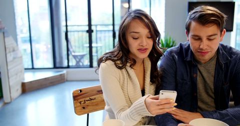 Couple Sharing Moments on Phone at Home - Download Free Stock Images Pikwizard.com