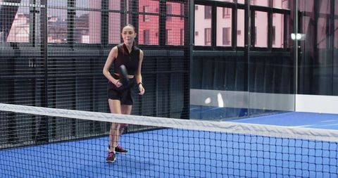 Female Athlete on Modern Indoor Padel Court