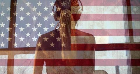 Woman with Headphones Looking Out Window with USA Flag Overlay - Download Free Stock Images Pikwizard.com