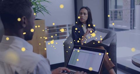 Hispanic Woman Leading Office Discussion in Modern Workspace
