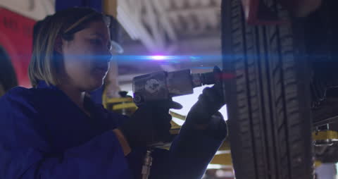 Female Mechanic Fixing Car with Light Effects