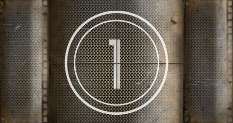 Vintage rusty film reel countdown with number 1