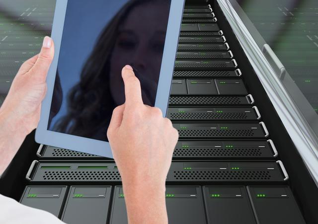 Digital composite image of woman using digital tablet against server room background