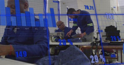 Technicians Analyzing Machinery Data with Digital Overlay