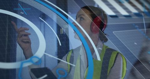 Female Technologist Using Digital Interface in Server Room
