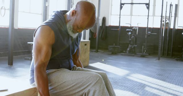 Senior Man Resting in Gymnasium After Intense Workout - Download Free Stock Images Pikwizard.com