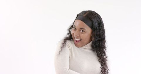 Joyful Woman with Curly Hair Expressing Excitement