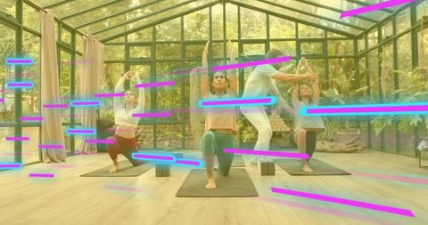 Group yoga class practicing kneeling lunges in sunlit glass conservatory with neon streaks