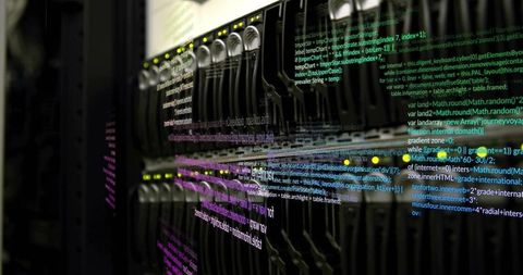 Blurred network switch with overlaid code in datacenter environment