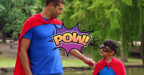 Father and Son Bonding in Superhero Costumes Amidst Nature