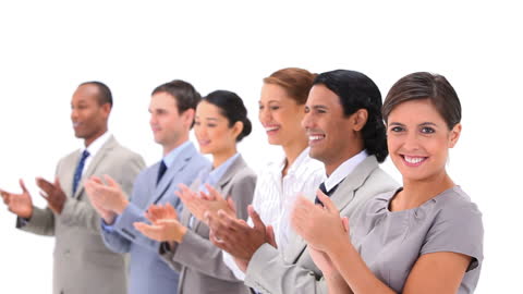 Group of well-dressed individuals expressing appreciation and congratulations. Ideal for concepts related to teamwork, success, diversity, corporate achievements, and motivating contexts. Suitable for business promotions, presentations, and advertisements focusing on multicultural teams and workplace dynamics.