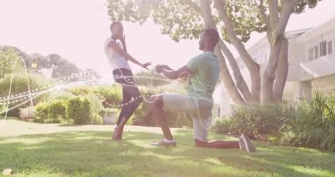 Romantic Proposal in Garden Setting with Symbolic Hearts Around