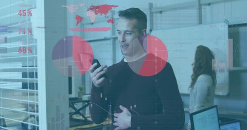 Businessman Analyzing Financial Data with Digital Interface in Modern Office