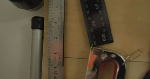 Assorted tools and measuring devices in leather workshop