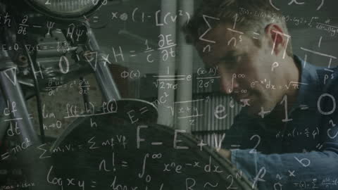 Caucasian Male Mechanic Analyzing Complex Mathematics in Workshop