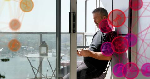 Senior Man Using Smartphone on Balcony Surrounded by Virtual Network
