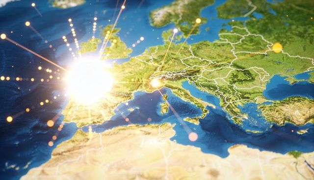 Digital network glowing over western europe map with bright burst and connected nodes