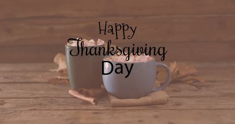 Happy Thanksgiving Day with Hot Chocolate Mugs on Wooden Background