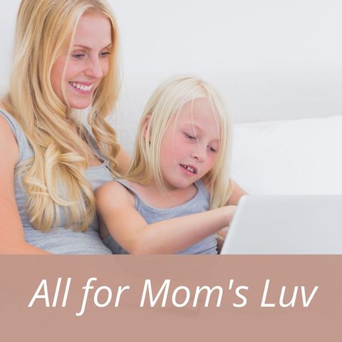 Mother and daughter bonding over laptop time at home