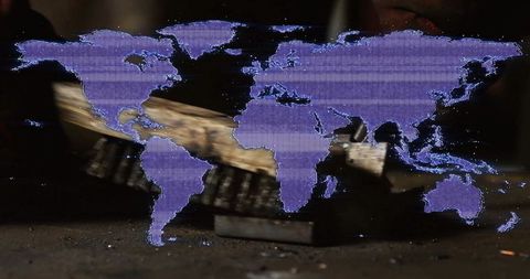 Glitching purple world map over industrial scene