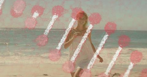 Woman in white sundress enjoying a blissful beach penetrated by red abstract shapes