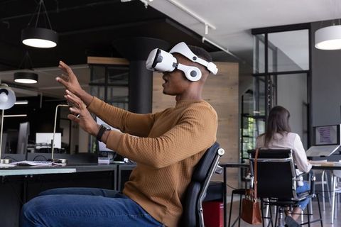 Employee Engaging with Virtual Reality in Modern Office