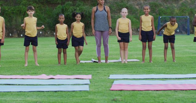 Children Practicing Yoga Outdoors with Instructor on Mats - Download Free Stock Images Pikwizard.com