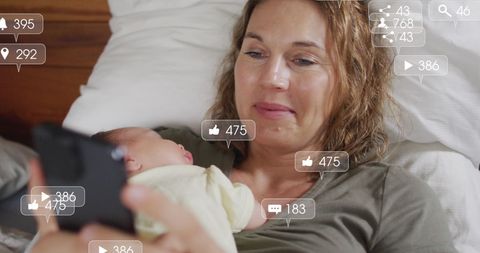 Mother with Infant Using Smartphone and Social Media Icons
